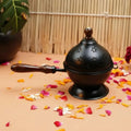 Black Metal Incense Burner With Wooden Handle And Decorative Cutouts