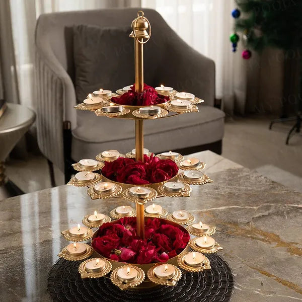Gold Tierplated Diya Stand With Candles And Flower Decoration